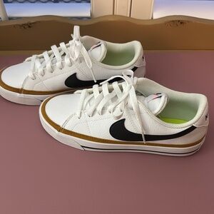 Nike White and Black Sneakers with Gold Accents